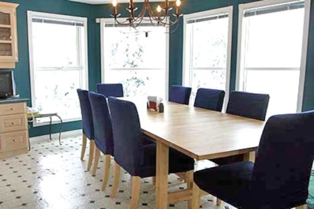 Enjoy meals together or entertain guests at the dining table, with seating for everyone.