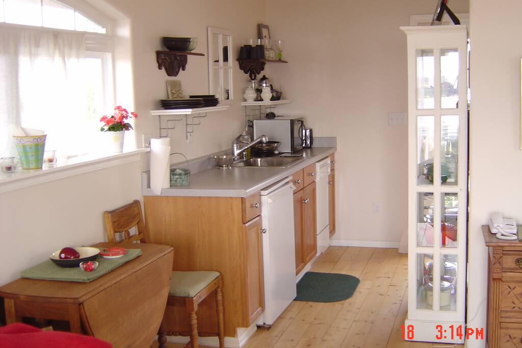 Fully functioning kitchen with dishwaster, Denby pottery and lovely antiques to warm new construction. Claw foot soaking tub and shower.