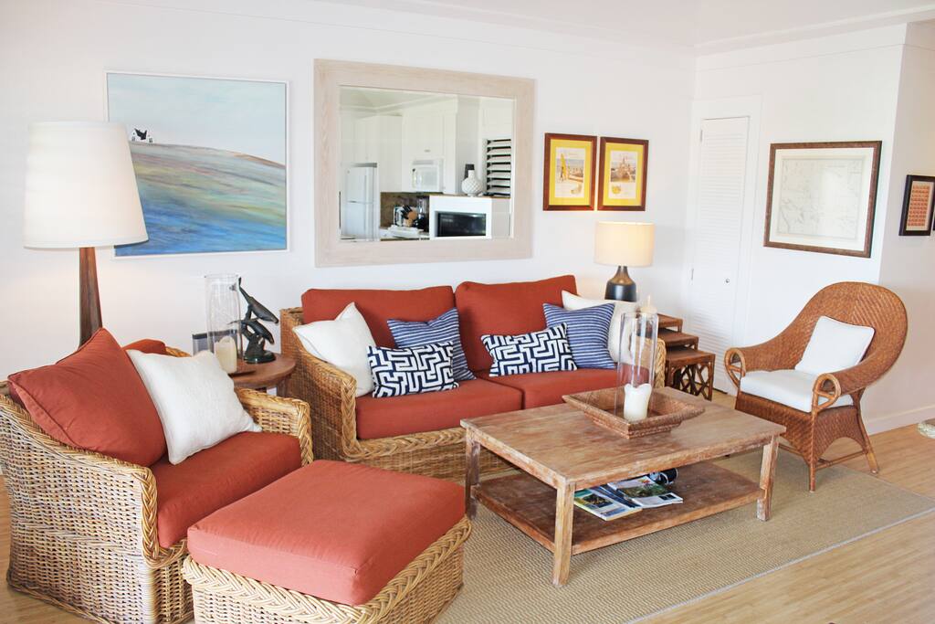 The open living room has a 14 foot high vaulted ceiling and ceiling fan