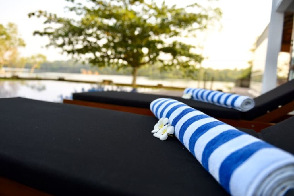 Lie by the pool overlooking the lake