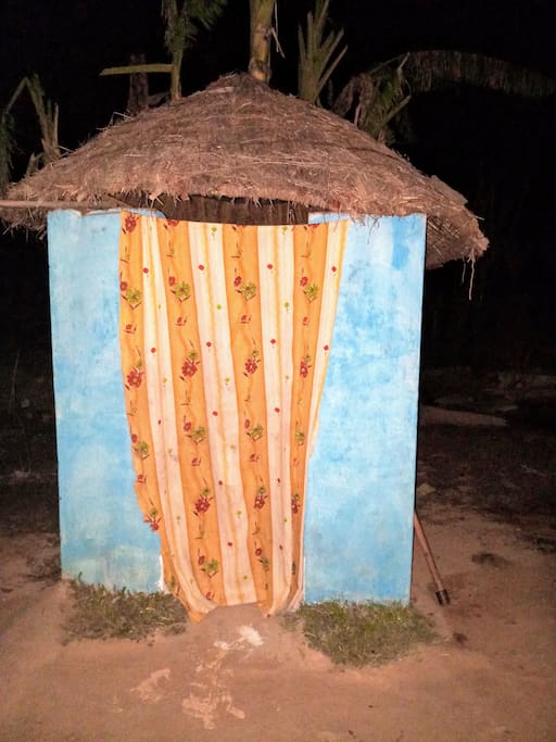 Space for bathing with the locally available grass roof