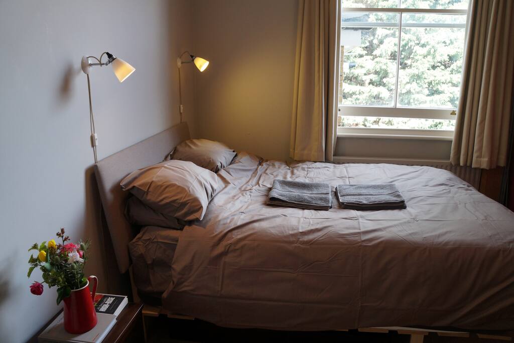 Warm comfortable bedroom that wakes with the morning sun
