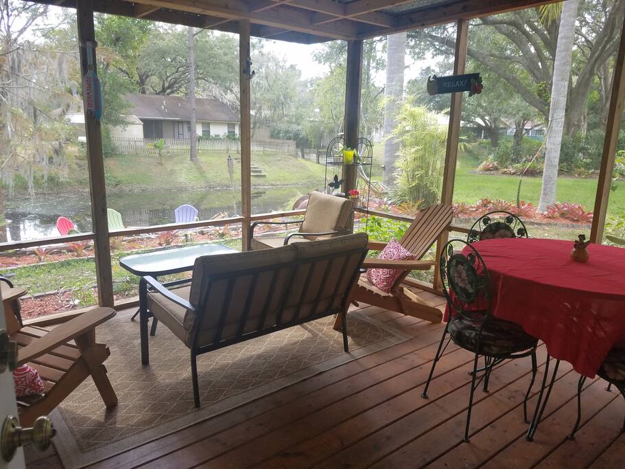 Patio overlooking Sunset Lake with dining area. Seating for 8