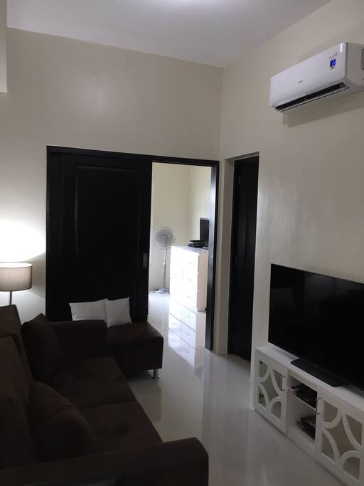 The living area with with a 48 inch flatscreen tv with cable