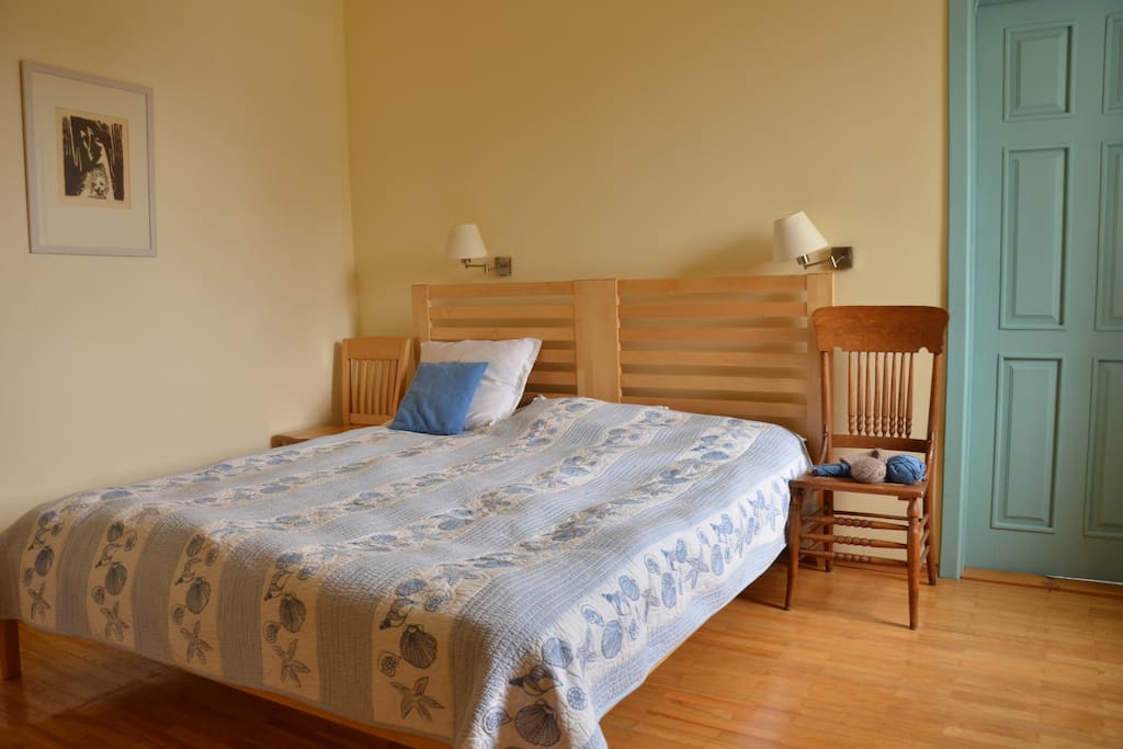 Master bedroom with it's bathroom behind the blue door.