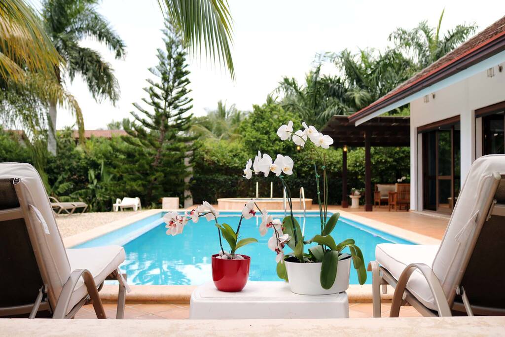 A gorgeous swimming pool is featured outdoors