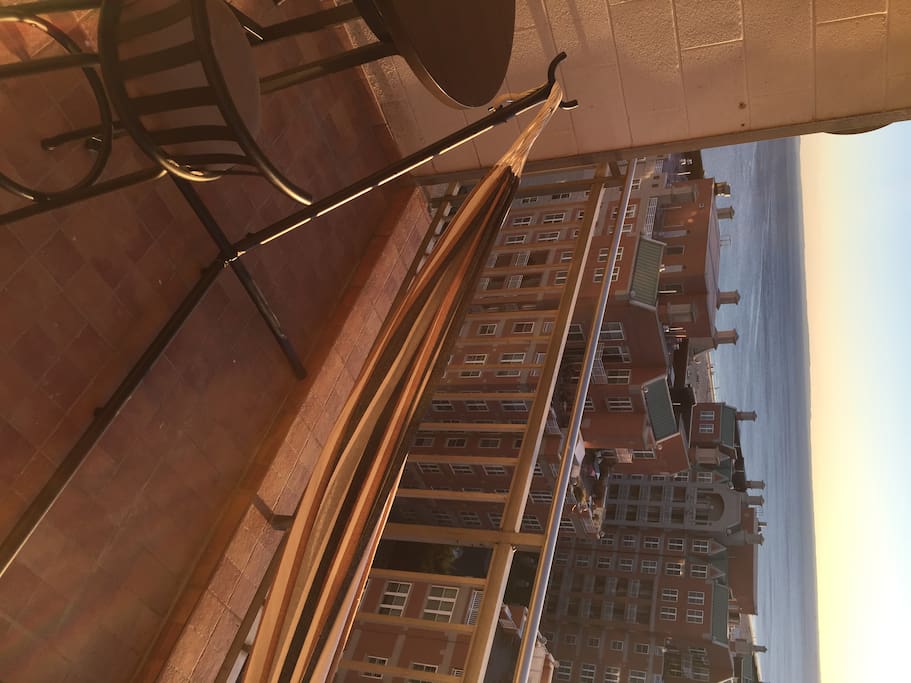 Lay on the hammock overlooking the ocean