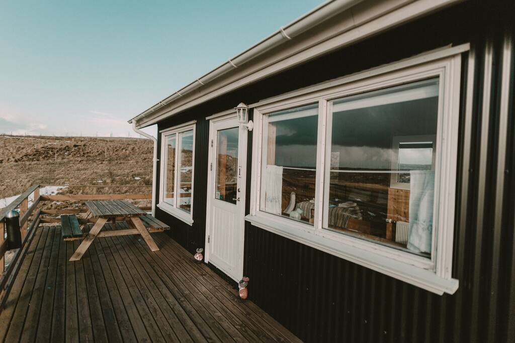 There is a patio in front of each cottage