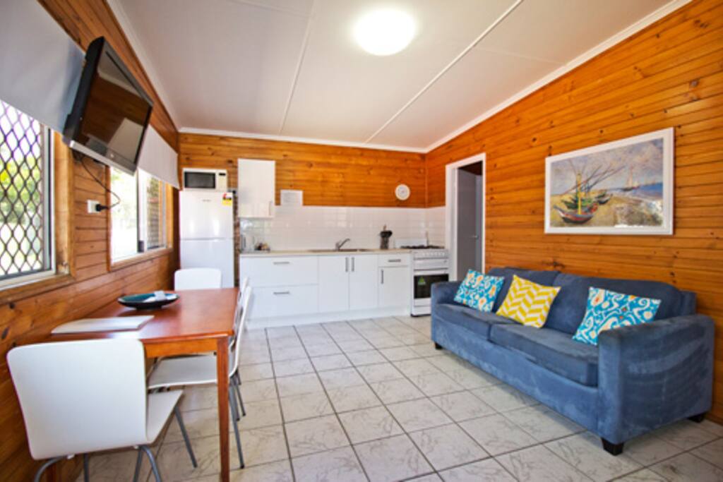 Kitchen, dining and lounge room of a two br villa