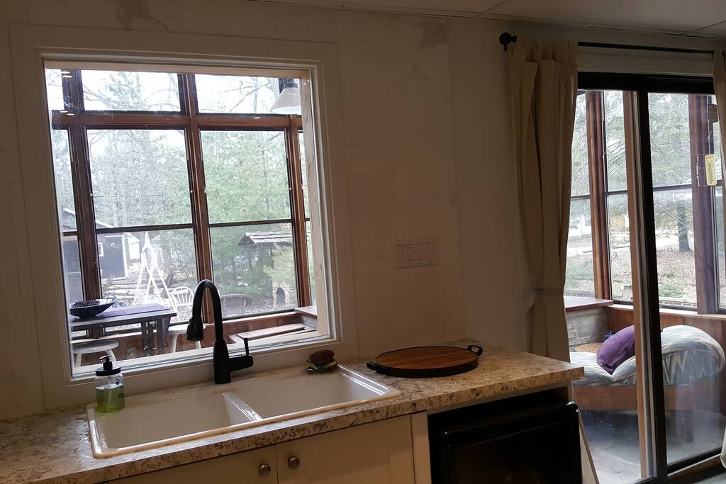 kitchen overlooking 2 storey solarium