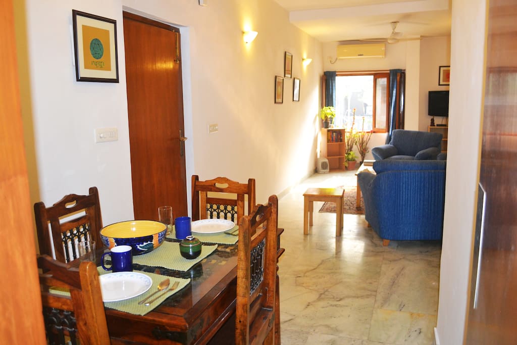 Dining Area + Living Room. Entrance to apartment via door on the left.