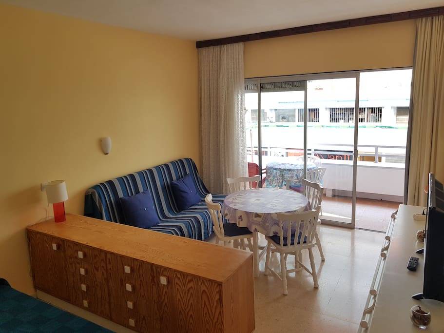 Living area with sliding door and balcony