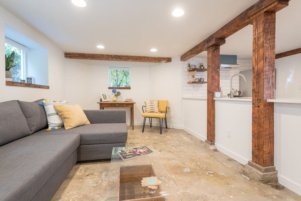 Original beams add a touch of rustic to the modern apartment.