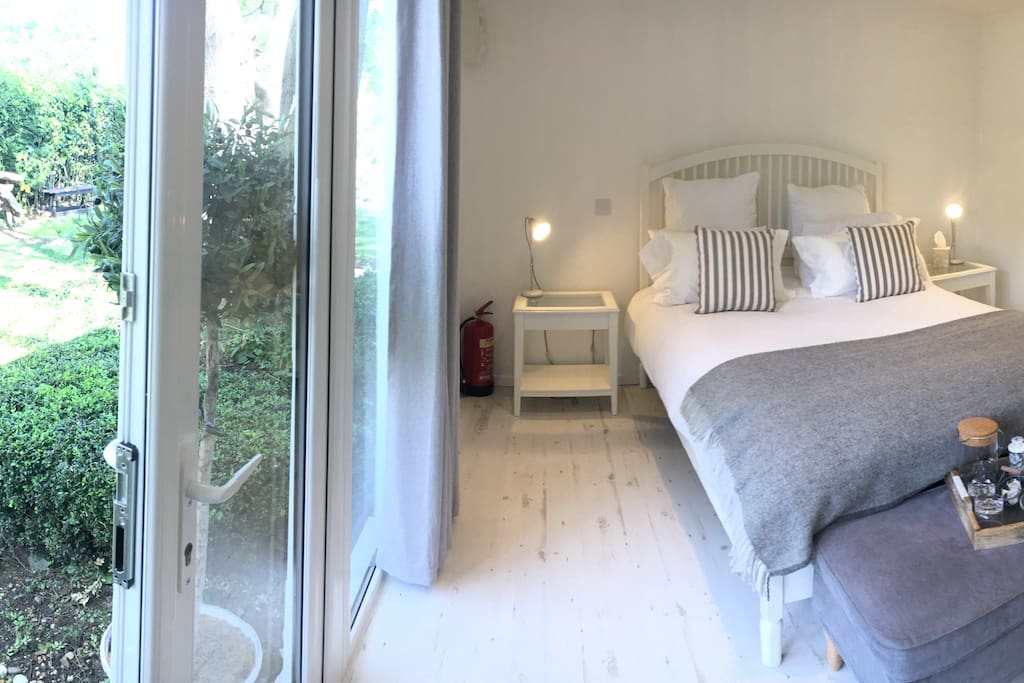 Luxury bedroom for two people. In a secluded garden with private access.