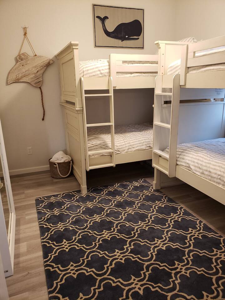 2nd bedroom sleeps 4 on two twin over twin bunks. New Serta mattresses on all beds.