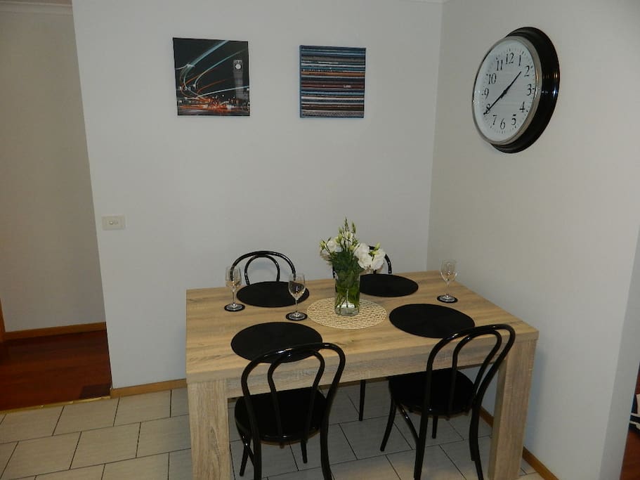 Comfortable dining area with natural light for 4 - 6 people.