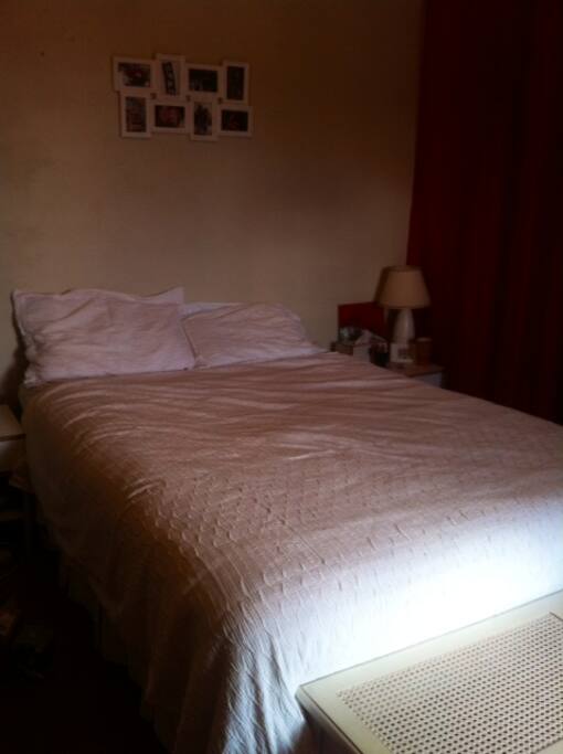Queen bed with new bed head.