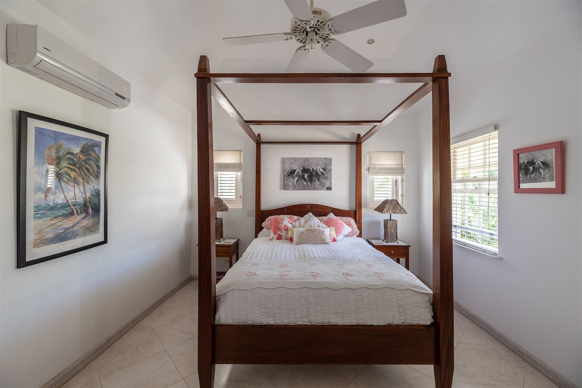 The second bedroom with a King sized bed, a built in wardrobe and air-conditioning