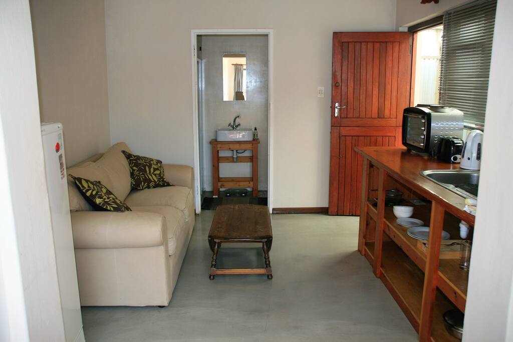 Lounge and kitchenette to bathroom and front door access
