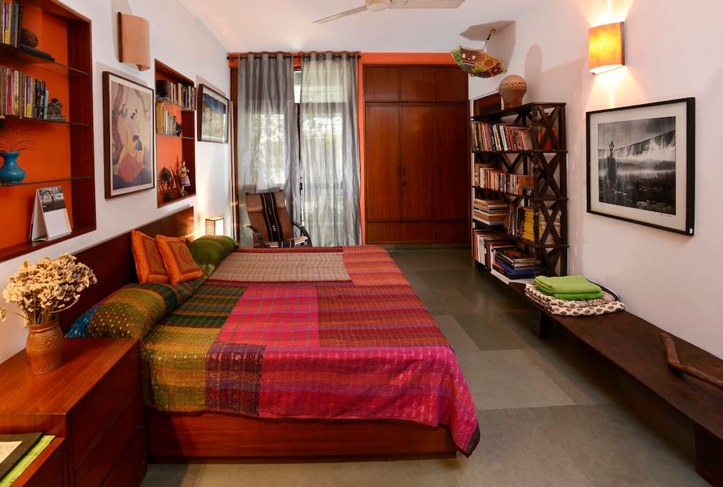 Your spacious bedroom with vivid, handcrafted furnishings and artefacts