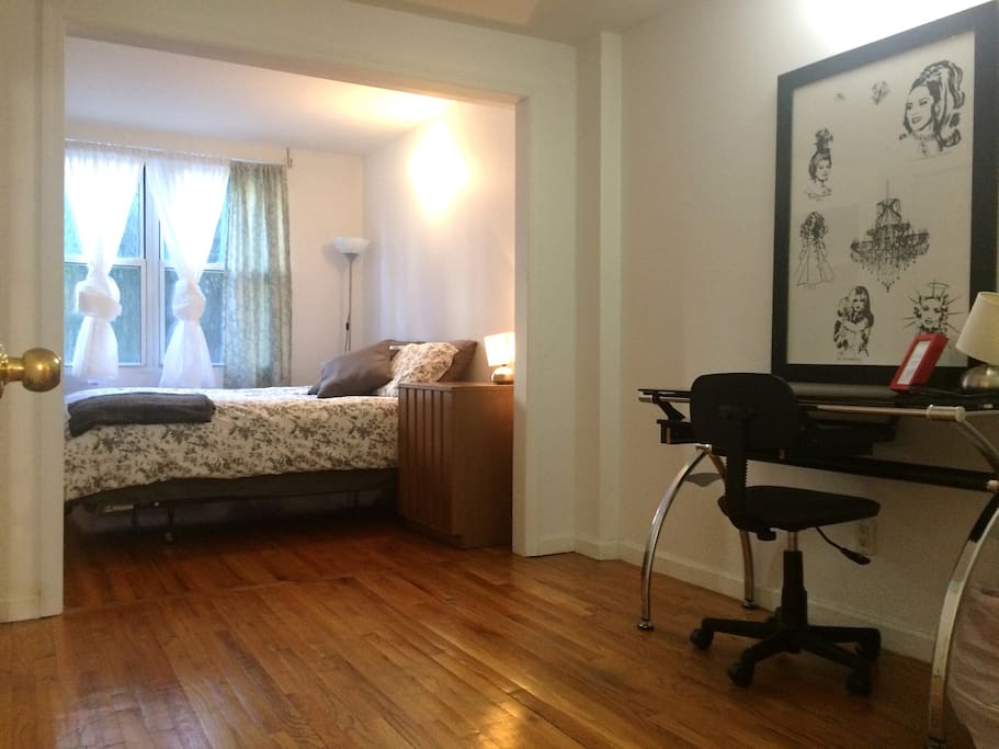 Queen Bed, All new bedding, curtains, hard wood floor. Glass desk with chair