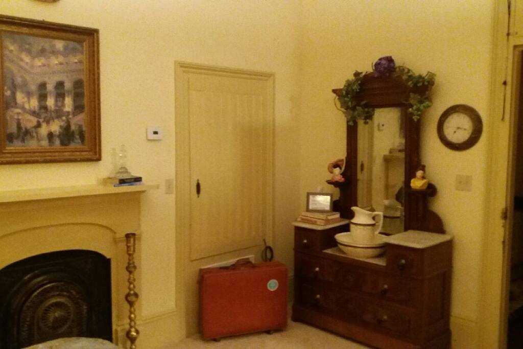 Original antique dresser still lives in suite.