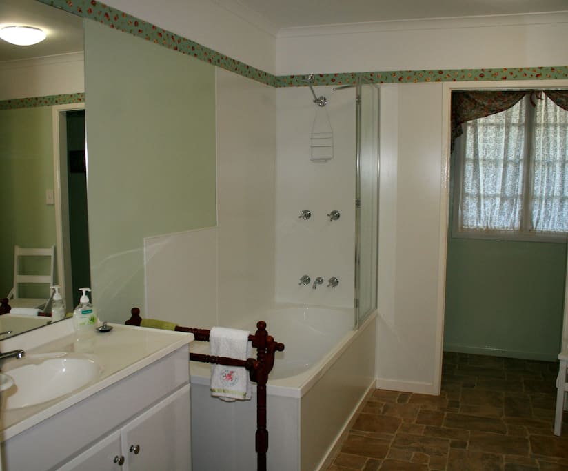 Private Bathroom shower over the bath.
