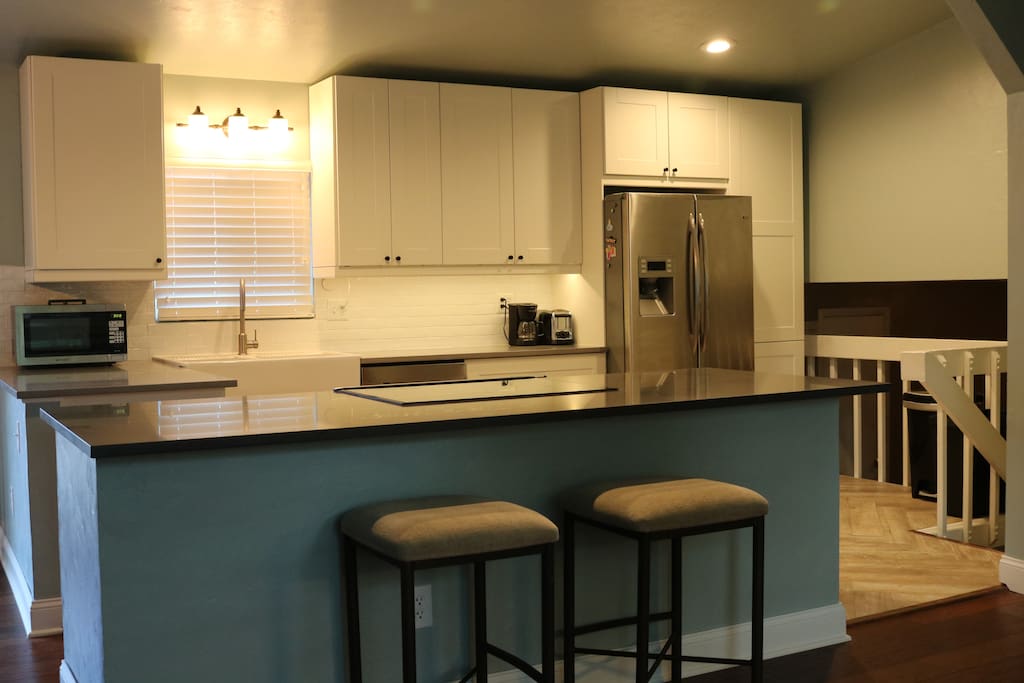 Completely remodeled kitchen with new IKEA cabinets, convection oven, dishwasher, coffee maker.