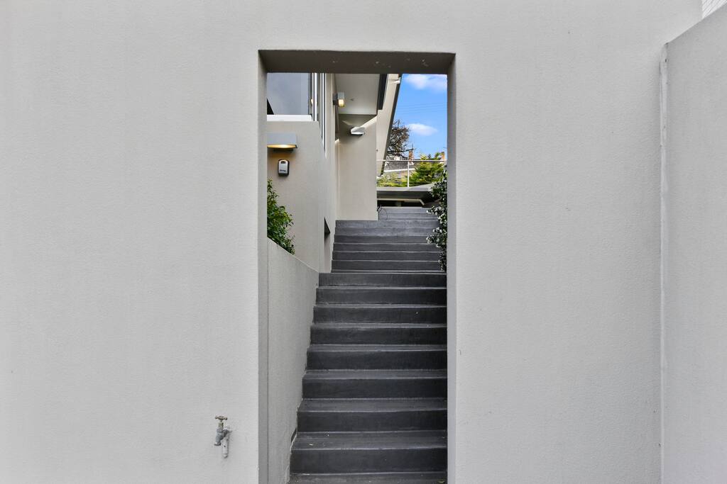 Entrance to the right of Garage. Access to Apartment 1