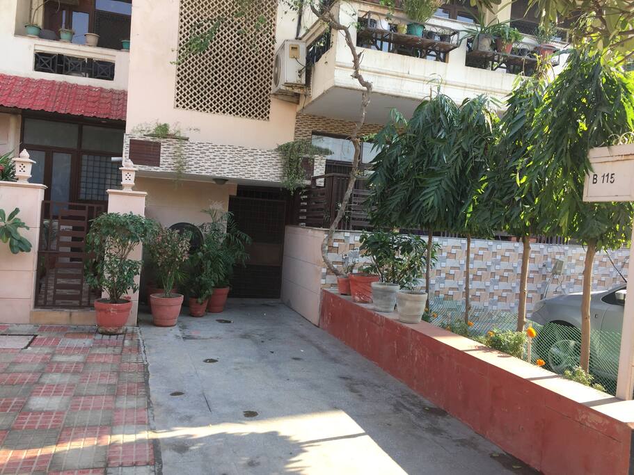 Entry and front with lots of greens and flowers