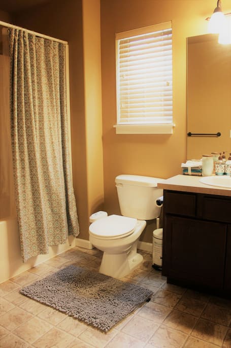 Full bath with tub. The toilet has a bidet. It's a shared bath.