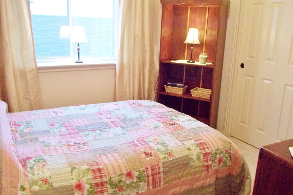 Adorable bedroom with large closet and big window.