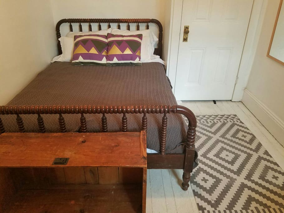 Here's your bedroom - cosy but workable for friends or a couple. There's a dresser and in the summer I'll put in an ac unit. Ceiling fan too.