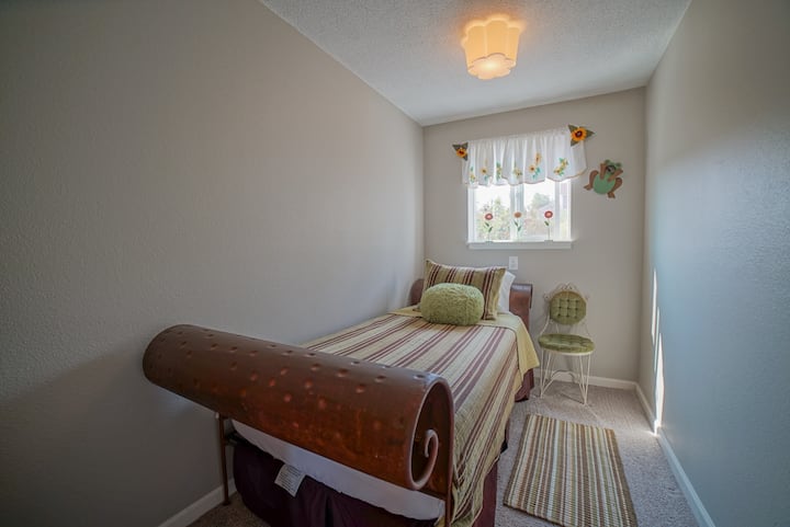 Separate room with twin bed, Room has dresser. 

