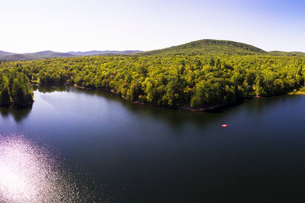 Drone pic of Santa Claus Lake facing the Guest Lodge. Red square in lake is our swim dock. Thanks to friend and professional photographer Julien Jarry! www.julienjarry.com