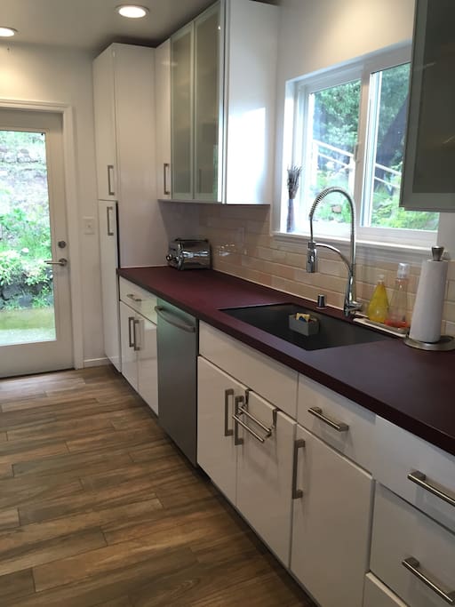 Chefs kitchen with new appliances and every cooking tool you can imagine.