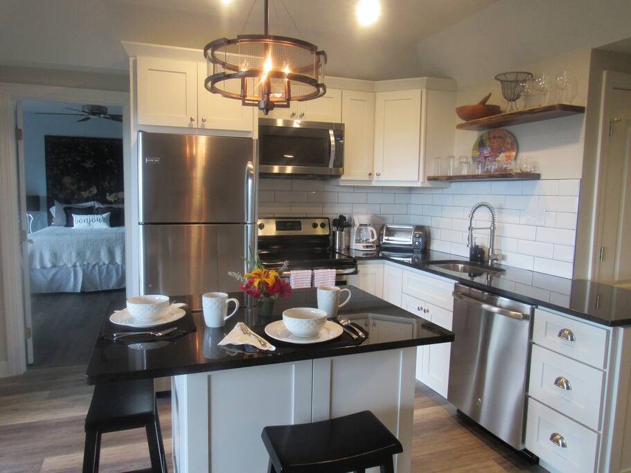 New modern kitchen, granite countertops, black walnut floating shelves, fully equipped.