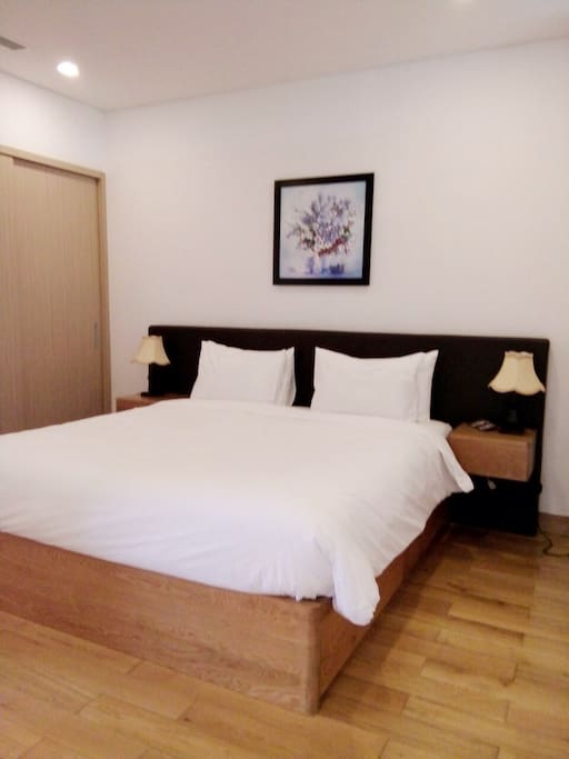 Bedroom with king bed and beautiful hard-wood floor
