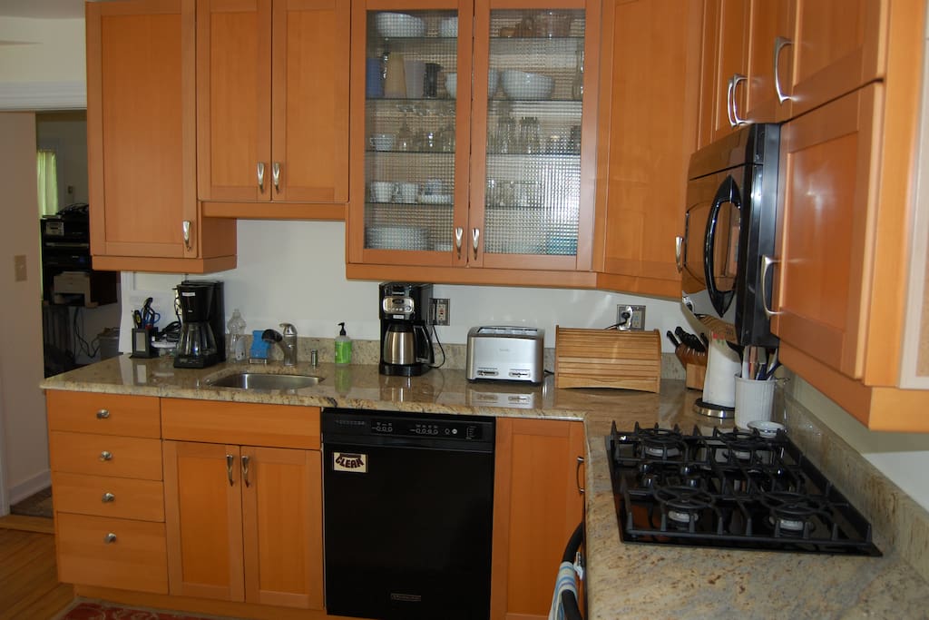 Other view of kitchen. Coffee maker, toaster, cabinet with plates etc.