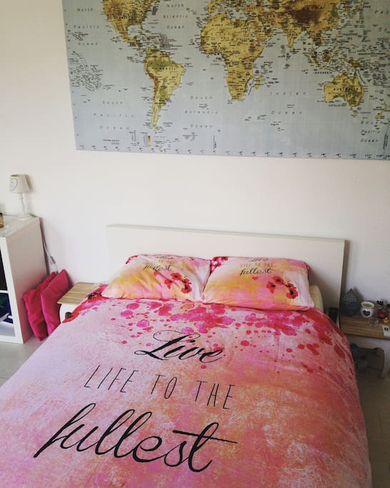 Comfortable two-persons bed in the bedroom