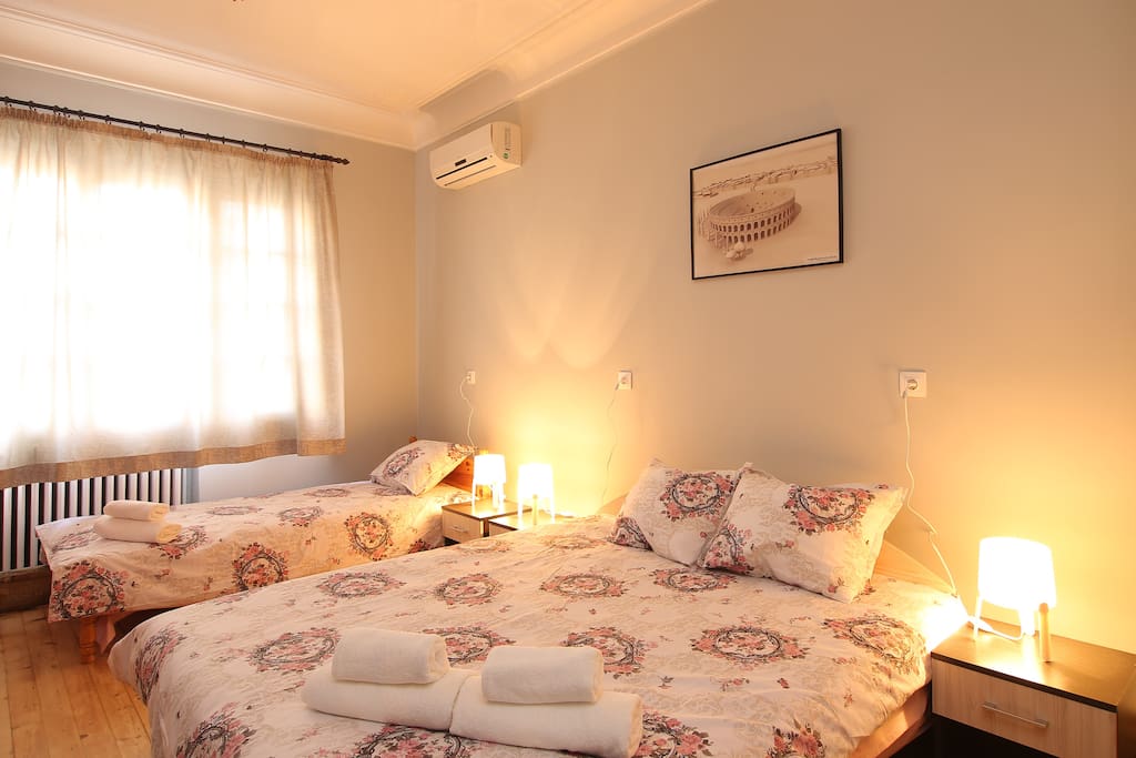 Room with double and single bed