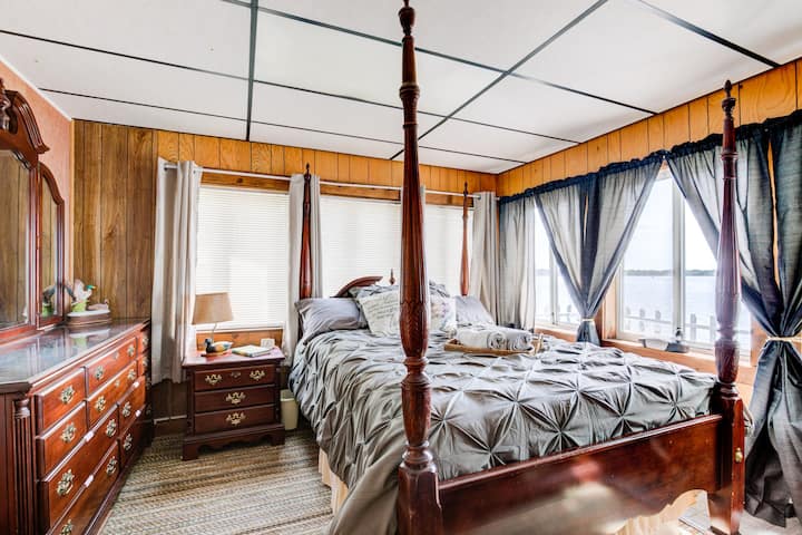 The master bedroom is lake side with calming water views. Queen bed with plenty of dresser space