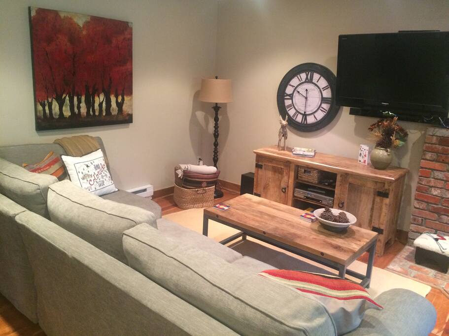 Living Room with sleeper sectional, cable TV & DVD player