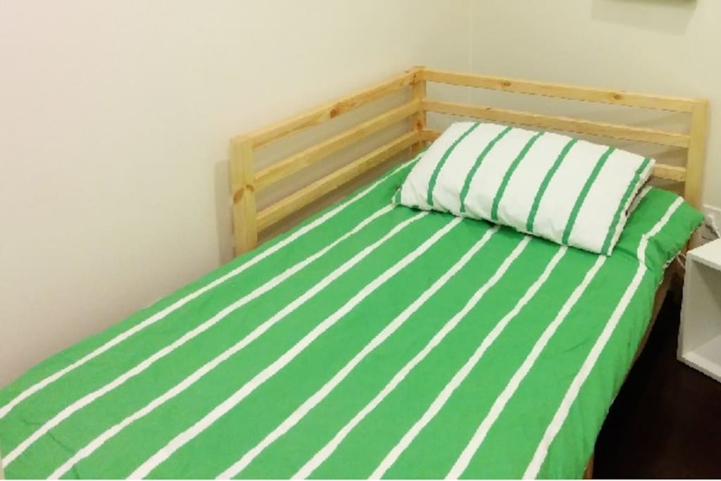 Comfortable single bed on upper floor