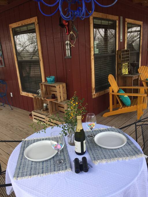 Relaxing outdoor dinning on the porch overlooking nature.