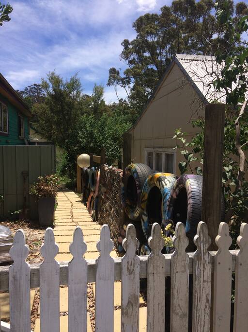 Entrance to Hilda's. Still a work in progress but getting there. Recycled tyre and gabion fencing.