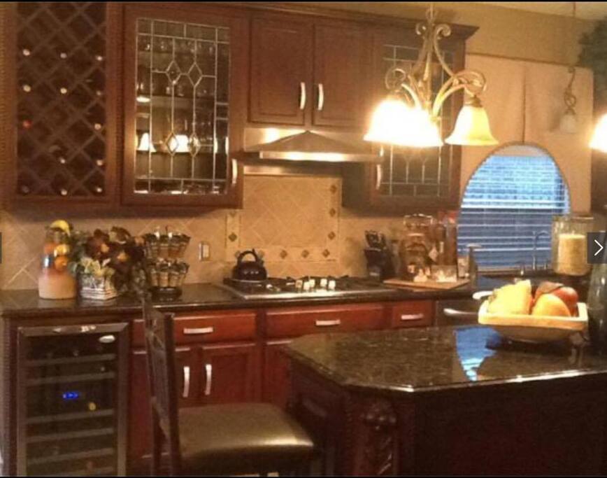 Very Large kitchen. Dinner table is located to the left and seats 4.