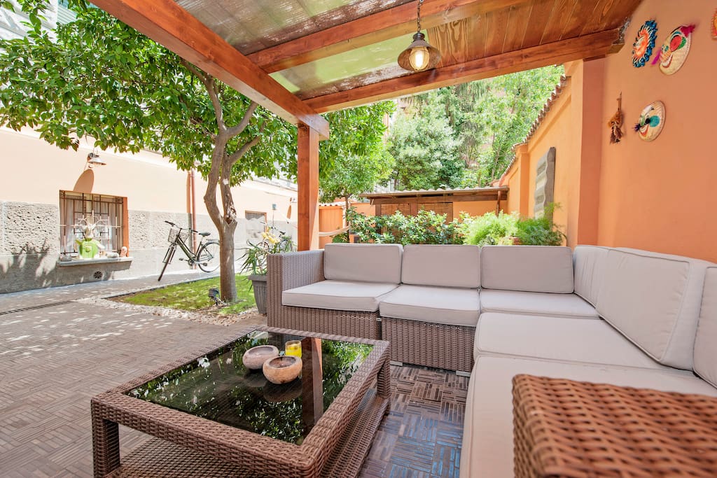 private garden with sunbeds, sofa, etc...