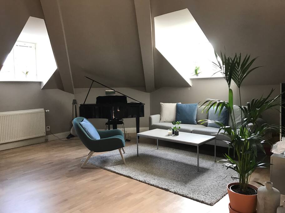 Our living room, with a grand piano in the corner.