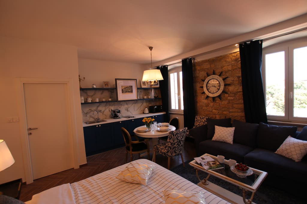 Studio apartment area is 30m2 with king size bed, sofa, fully equipped kitchen and shower bathroom.